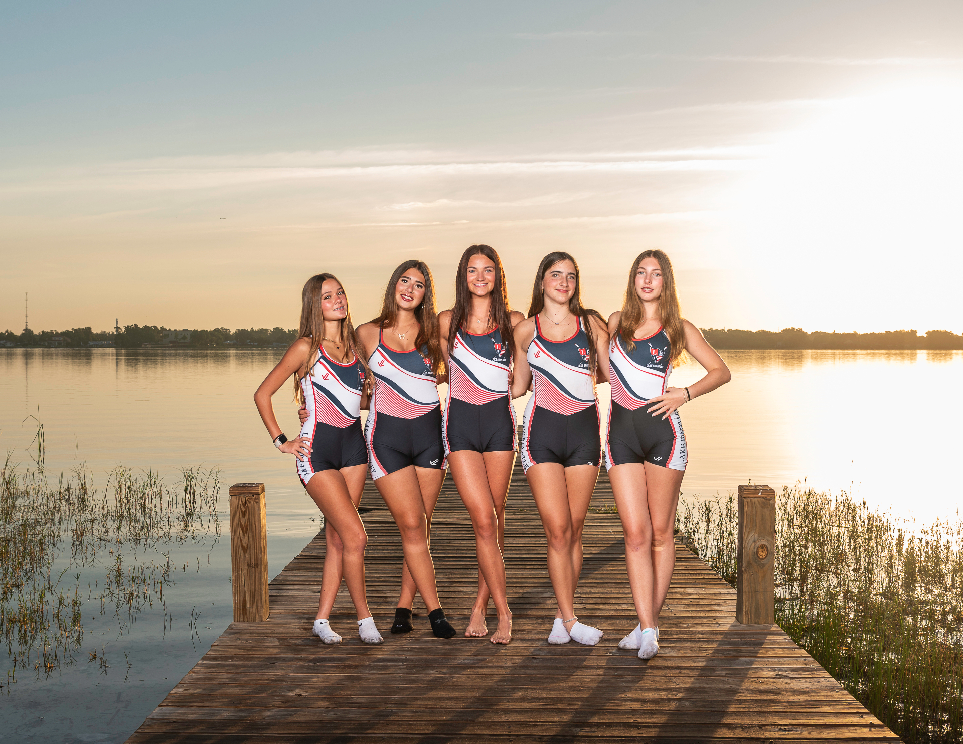 LBRA high school rowers on the dock at sunset